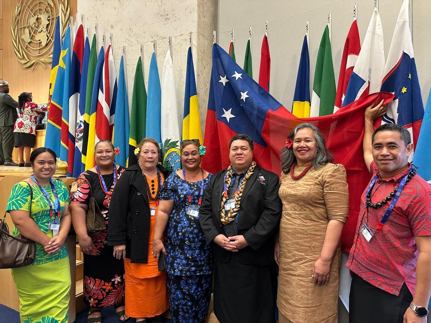 Members of Samoa's tripartite delegation with the national flag at the International Labour Conference in Geneva.