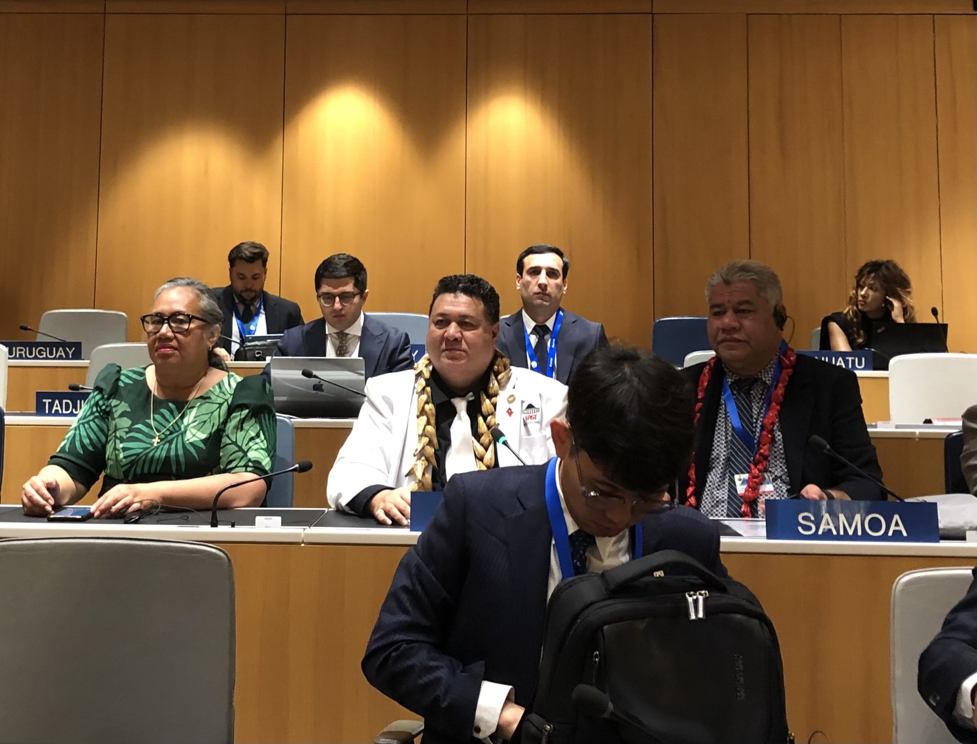 Samoa's delegation seated behind the Samoa nameplate in the WIPO assembly hall in Geneva.