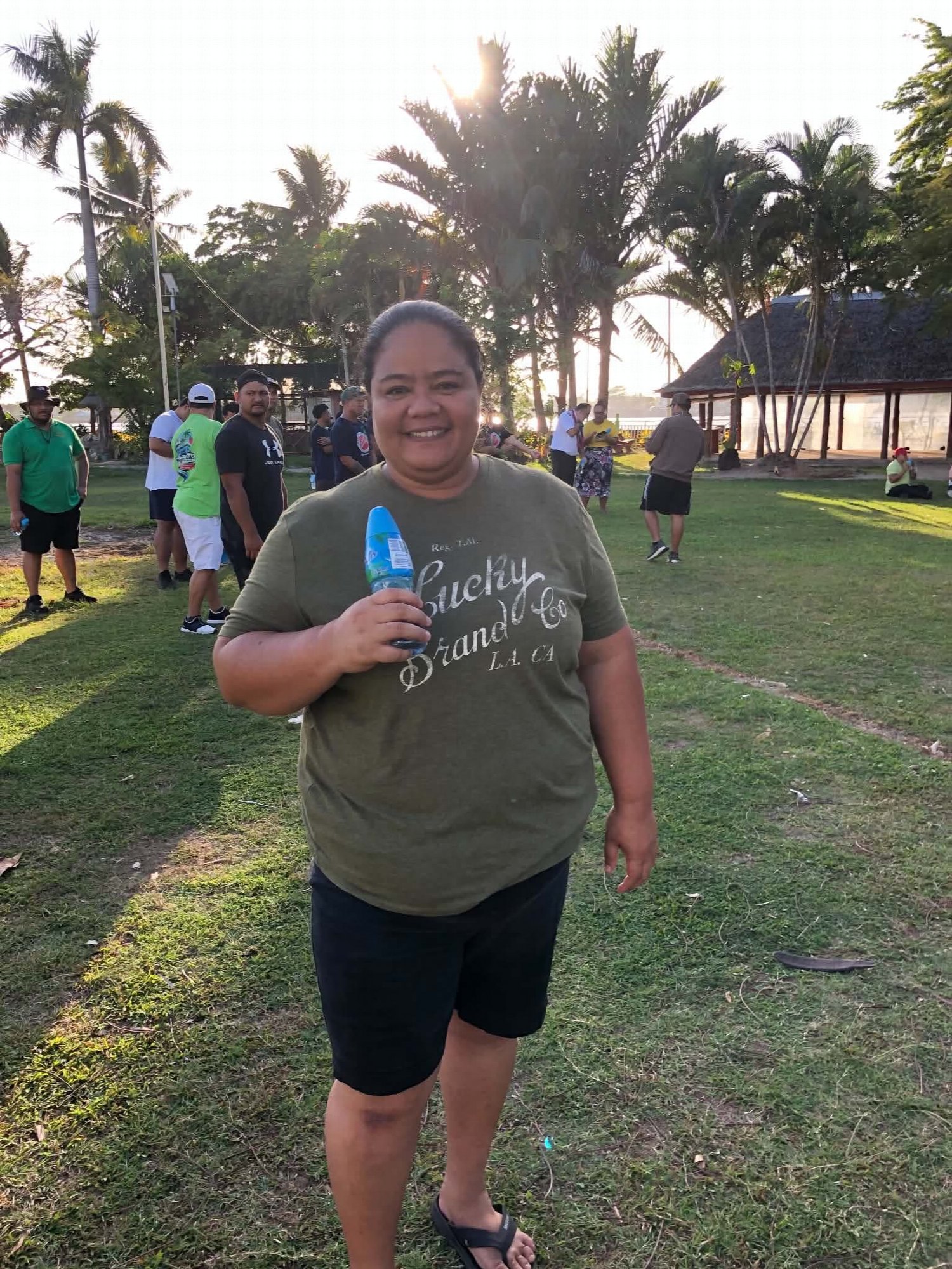 A participant smiles on the grounds during the Mental Health Awareness Walk